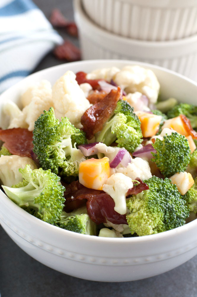 Broccoli Cauliflower Salad in a white bowl
