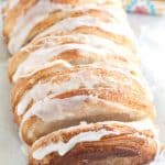 Pull apart bread on a table with lemons.