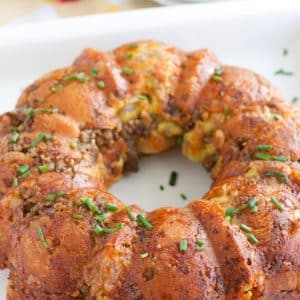 Sausage and egg pull apart bread on a platter.