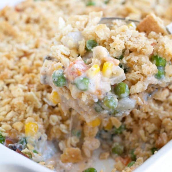 Vegetable casserole on a serving spoon.