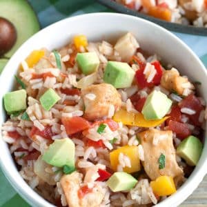 Bowl filled with rice and diced chicken.