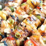 Grilled chicken and pineapple on a skewer.