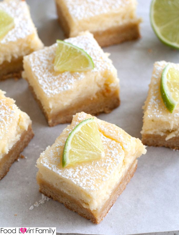 Cheesecake squares with slice of lime on top. 