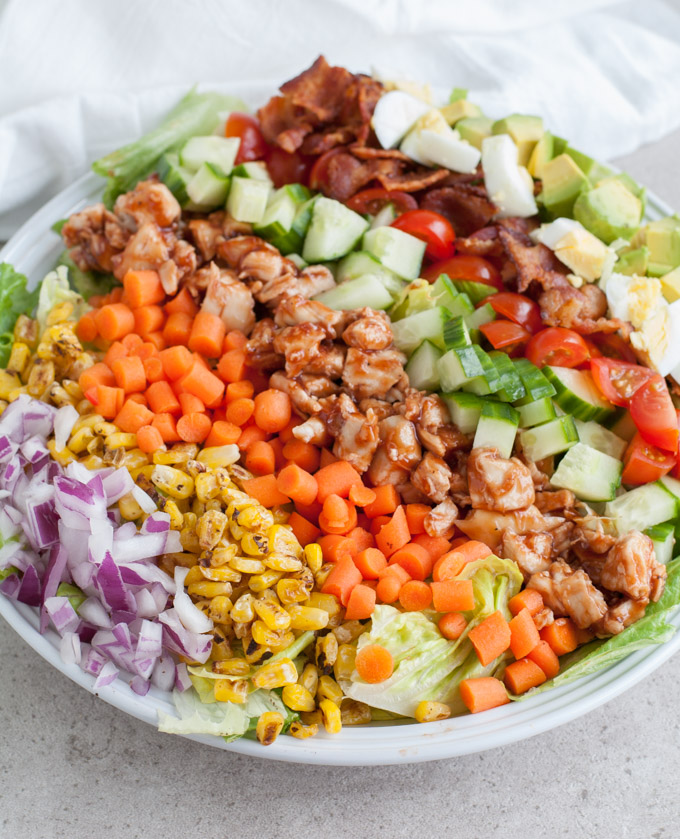 bbq chicken cobb salad with eggs, bacon and vegetables