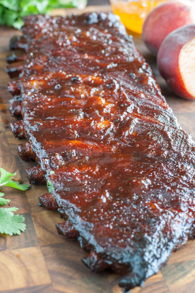 Peach Honey BBQ Ribs are tender, juicy and packed with flavor. They are easy to make so fire up the grill and get ready for some fall off the bone ribs.