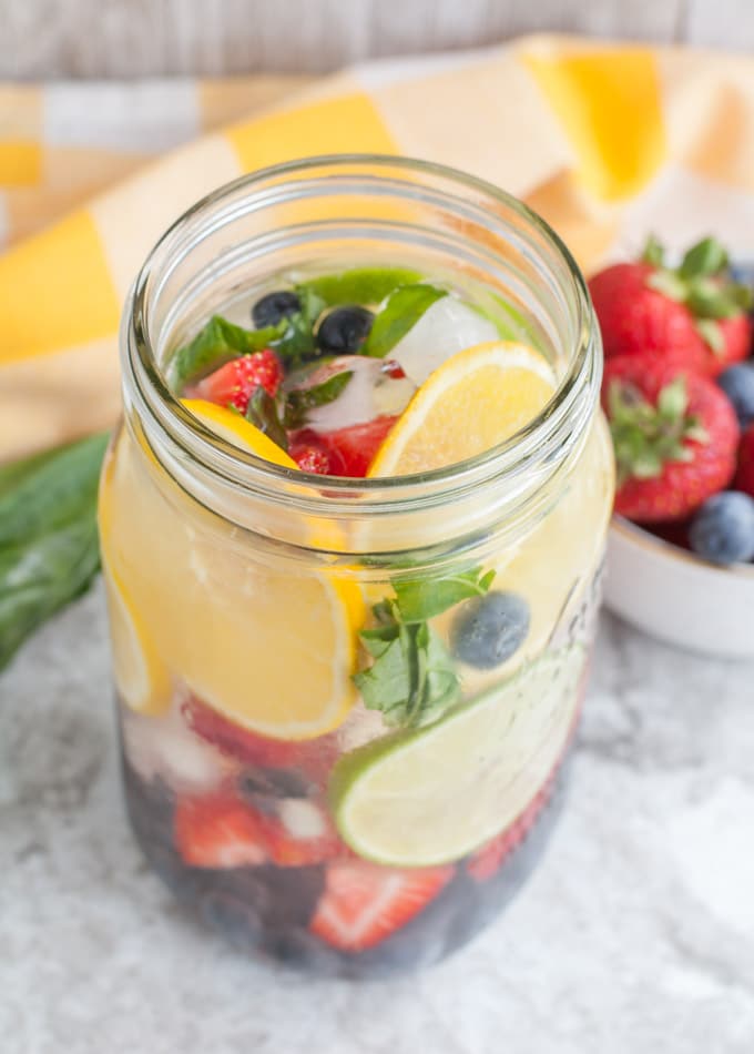 Rainbow Detox Water full of fruit and fresh basil