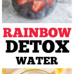 Jar of water with lemon, lime, blueberries and strawberries.