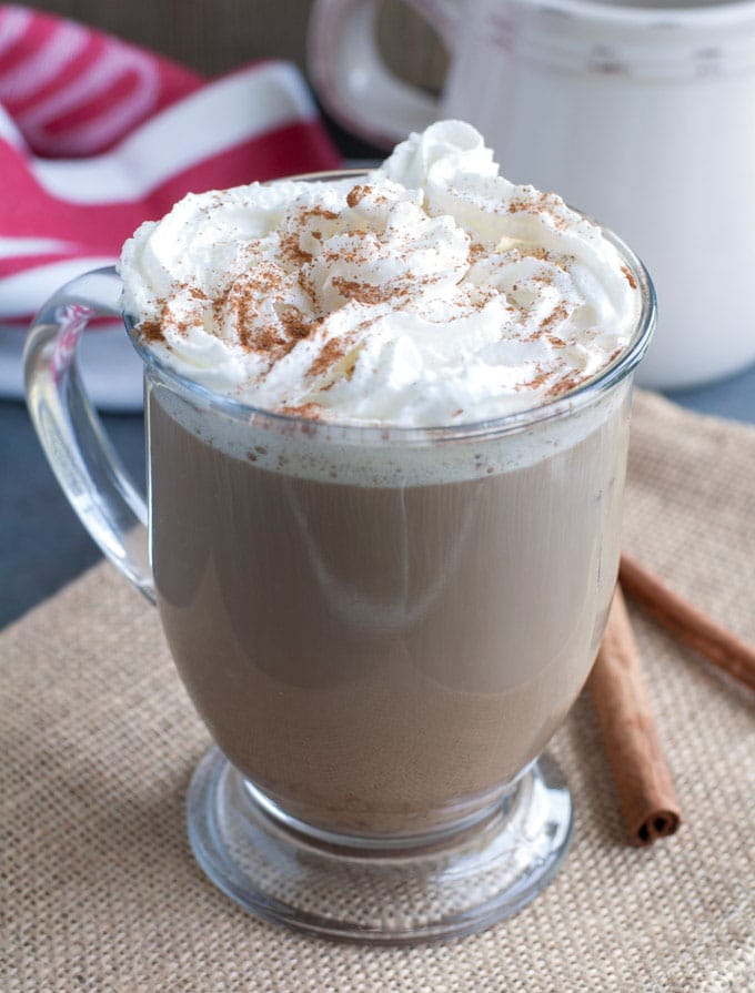 Latte in a mug with whipped cream