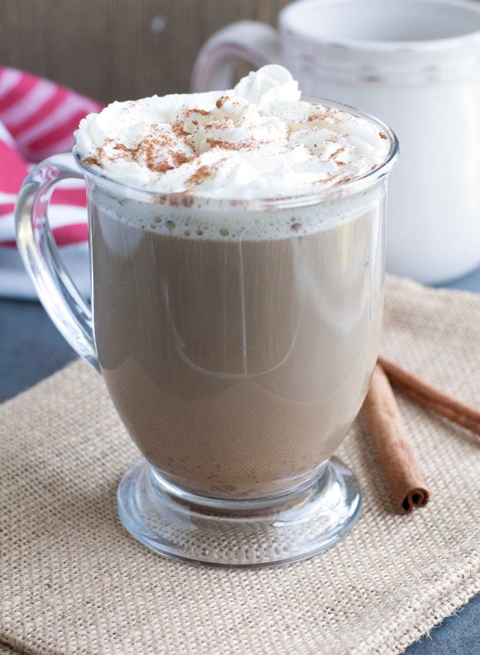 cinnamon roll latte topped with whipped cream