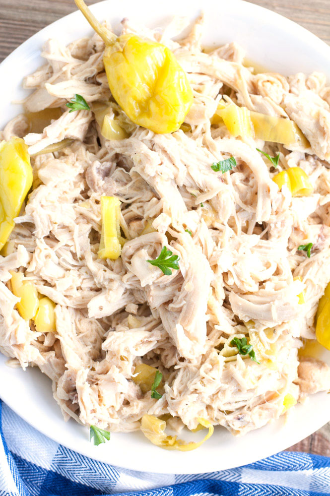 slow cooker chicken in a white bowl