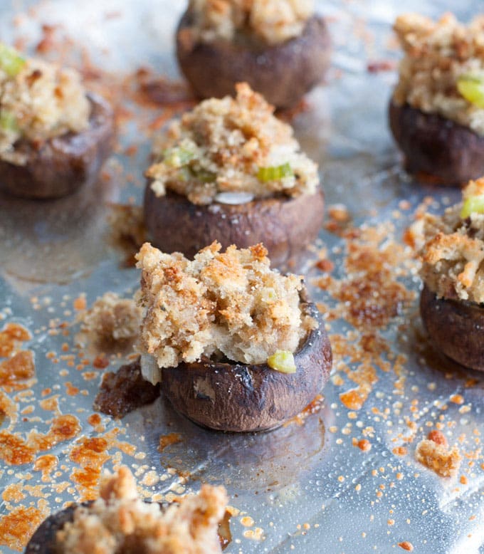 stuffed mushrooms on baking sheet