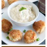 Mini crab cakes on plate.