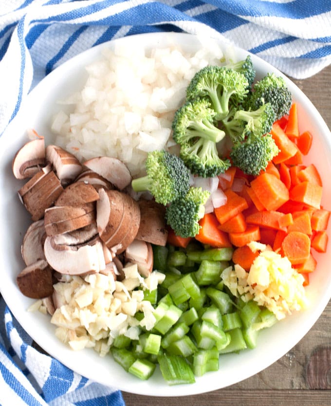 Bowl with mushrooms, onions, broccoli, carrots, celery, garlic