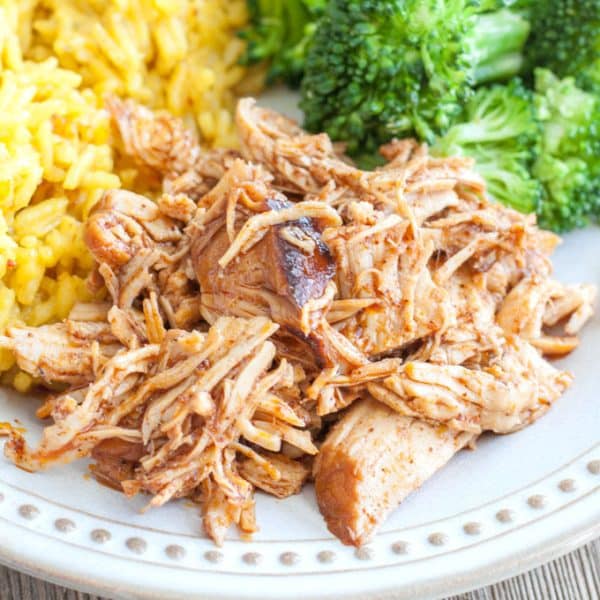 BBQ shredded chicken, rice, broccoli on plate.