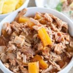 BBQ shredded pork with pineapple tidbits in a bowl.