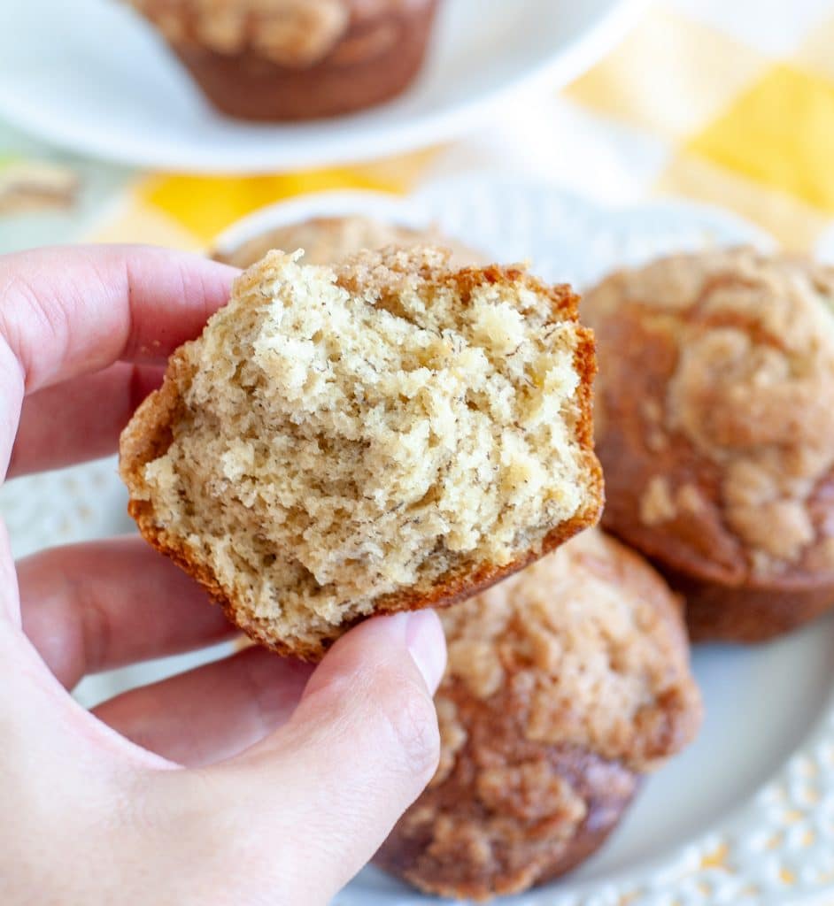 Hand holding a halved muffin