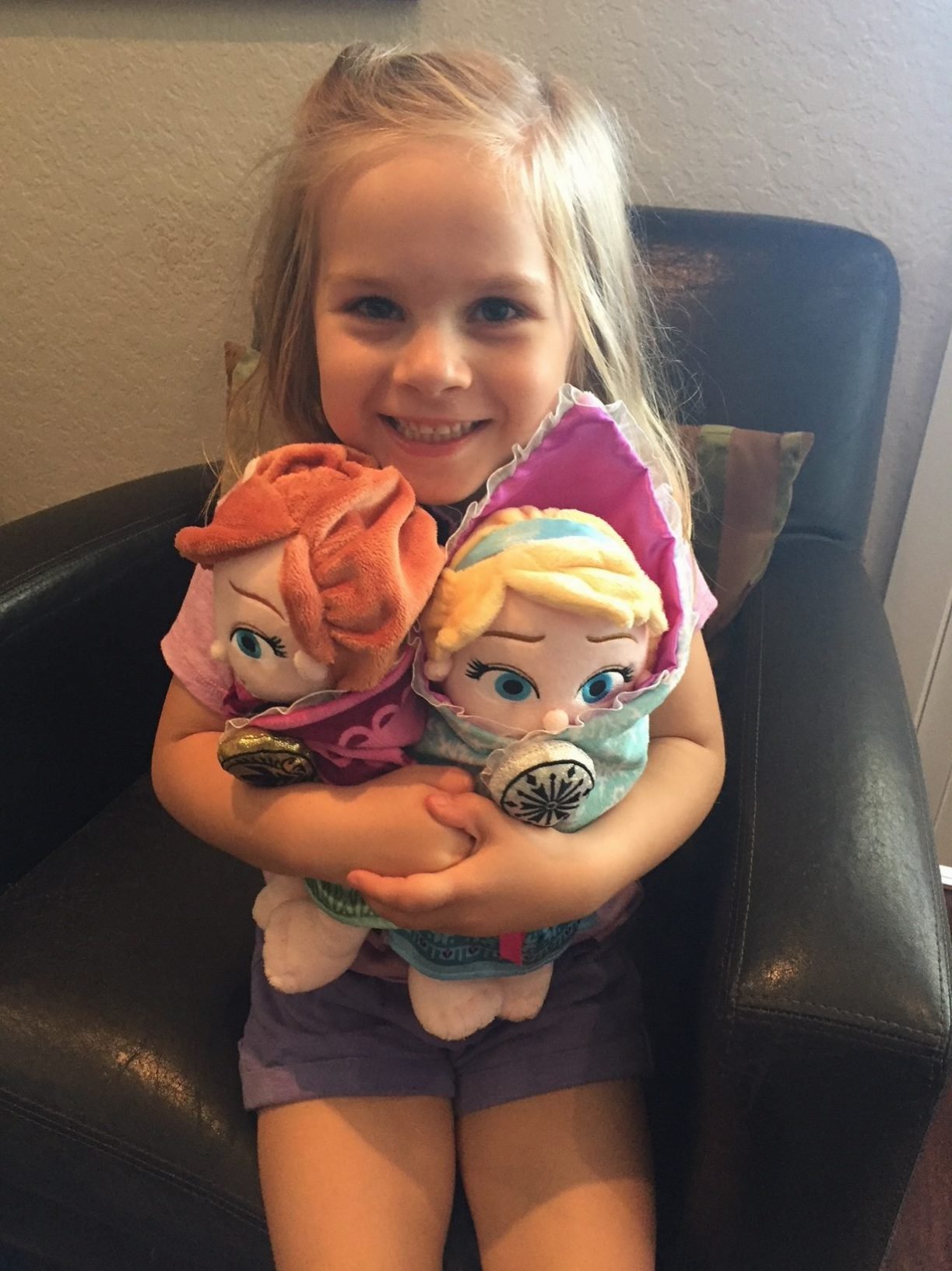 Little girl with stuffed animals. 