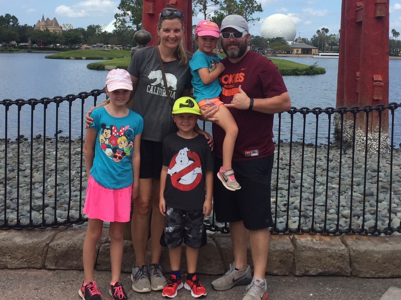 Family standing in Disney World. 