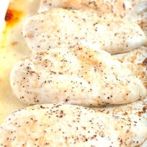 Cooked chicken breasts in a baking dish.