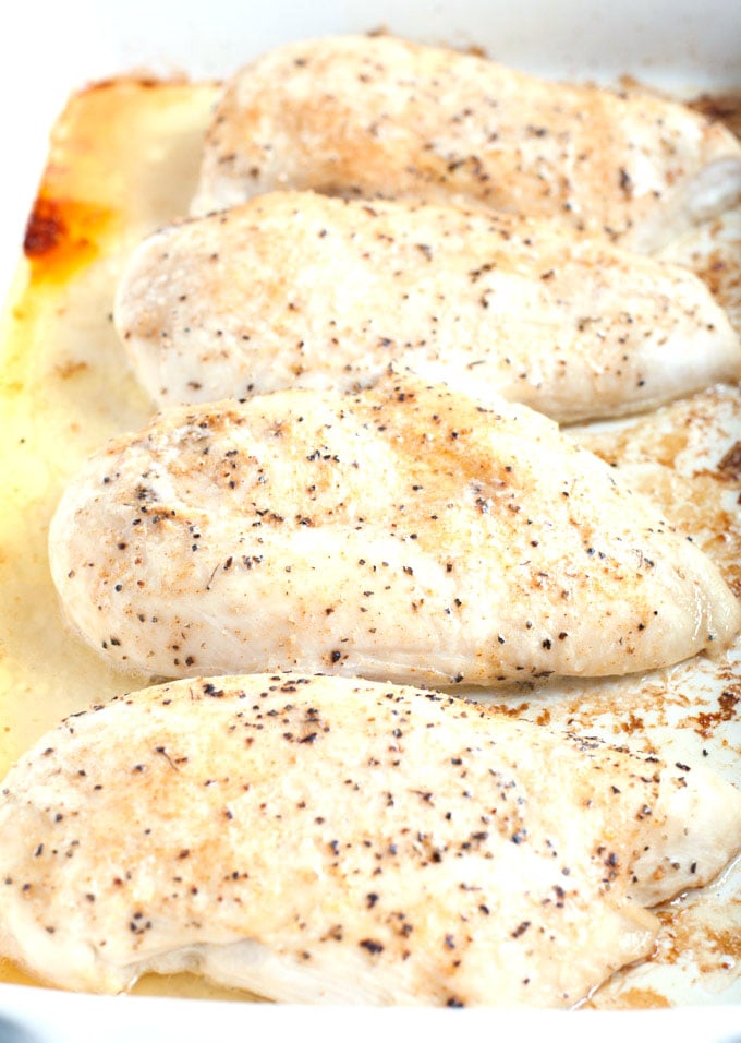 Cooked chicken breasts in a baking dish.