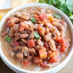Bowl with beans and tomatoes.