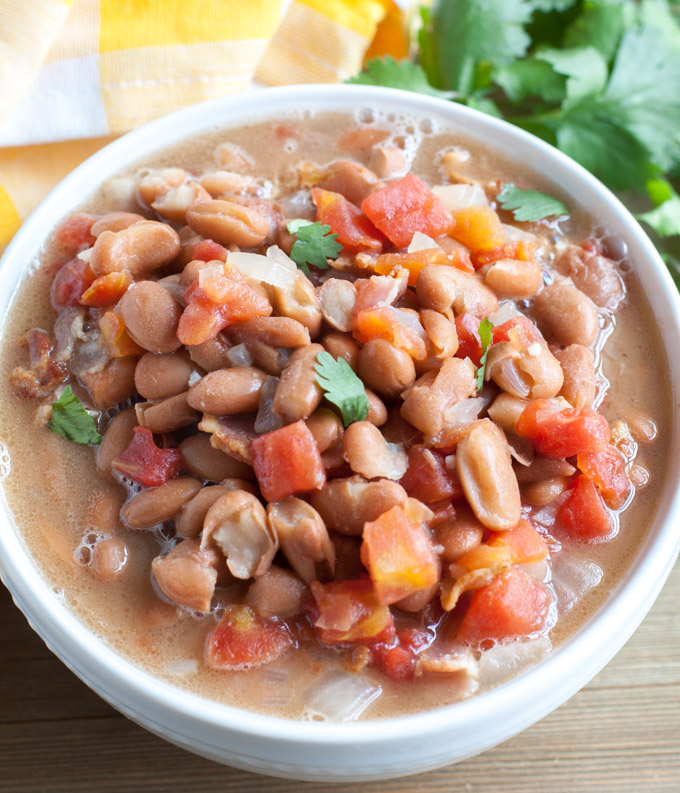 Bowl with beans and tomatoes. 