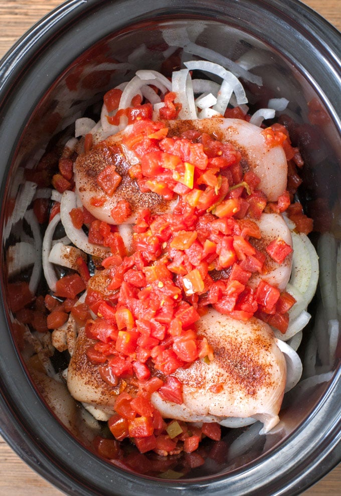  ingredients in slow cooker-diced tomatoes, chicken, onions and peppers