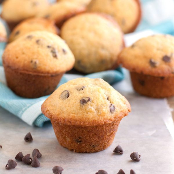 Chocolate chip mini muffins on table.