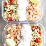 Container with shrimp, rice and corn salsa.