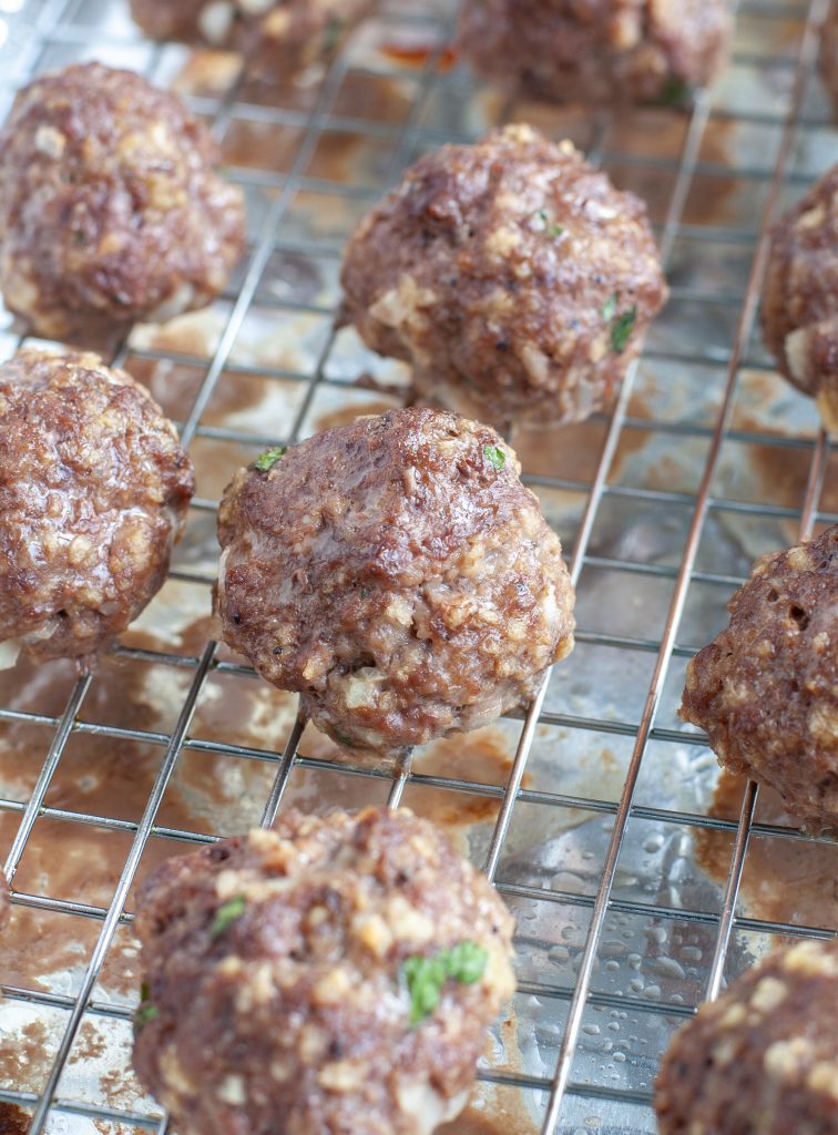 Baked meatballs on a wire rack