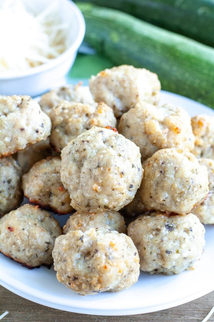 chicken meatballs staked on a white plate