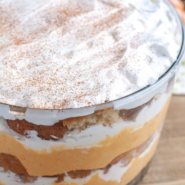 Layered pumpkin dessert in a bowl.