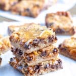 Stacked dessert bars on a table.