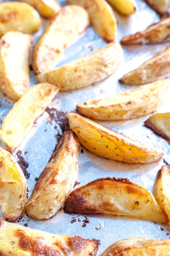 Potato wedges on baking sheet