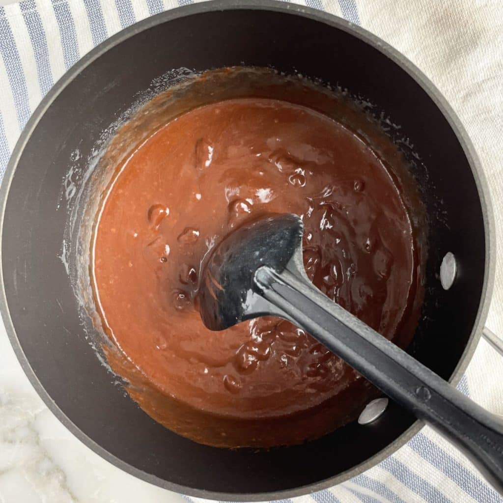Saucepan with melted chocolate.