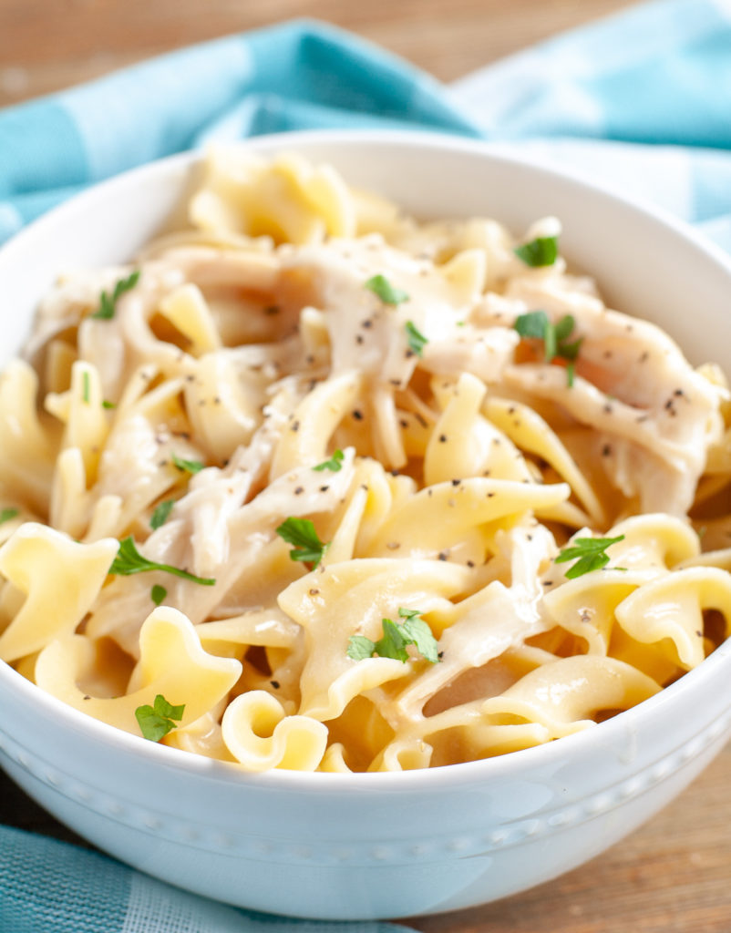 Chicken and Noodles recipe in a bowl with parsley