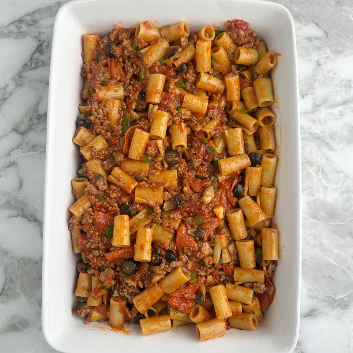 Casserole dish with pizza pasta. 