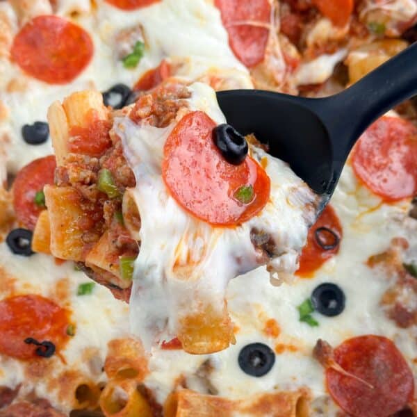 Pizza casserole with a serving spoon.