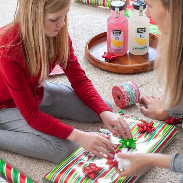 Girl wrapping present.