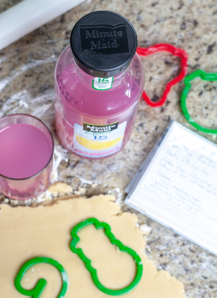 Bottle of pink lemonade and cookie dough. 