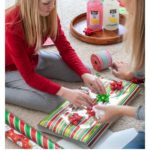Kid wrapping present.