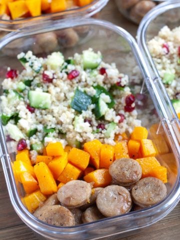 Container with sausage, butternut squash and quinoa salad.