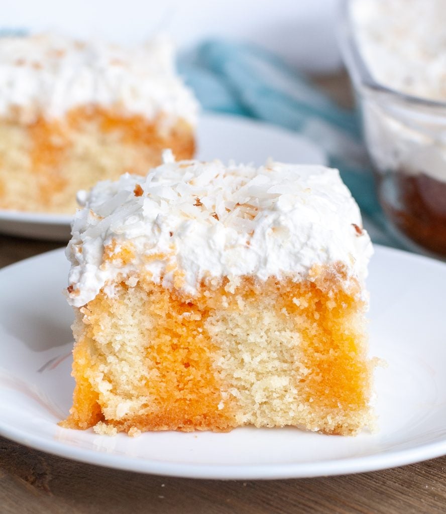 Orange Poke Cake Piece of orange poke cake on a plate