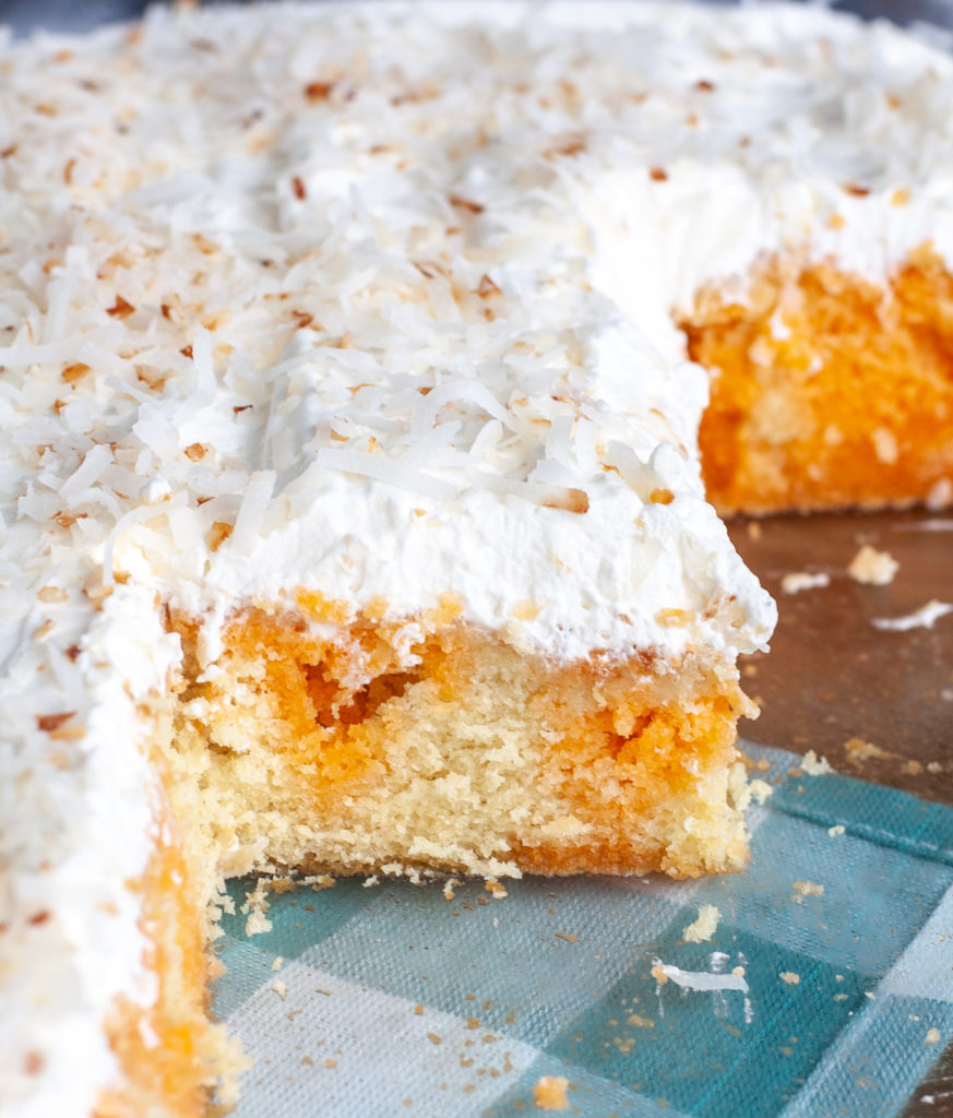 Orange Poke Cake in Baking Dish, cut