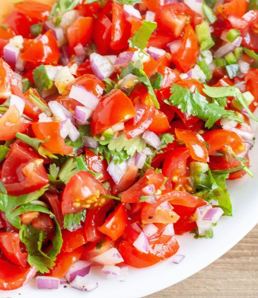 Pico de gallo in a white bowl