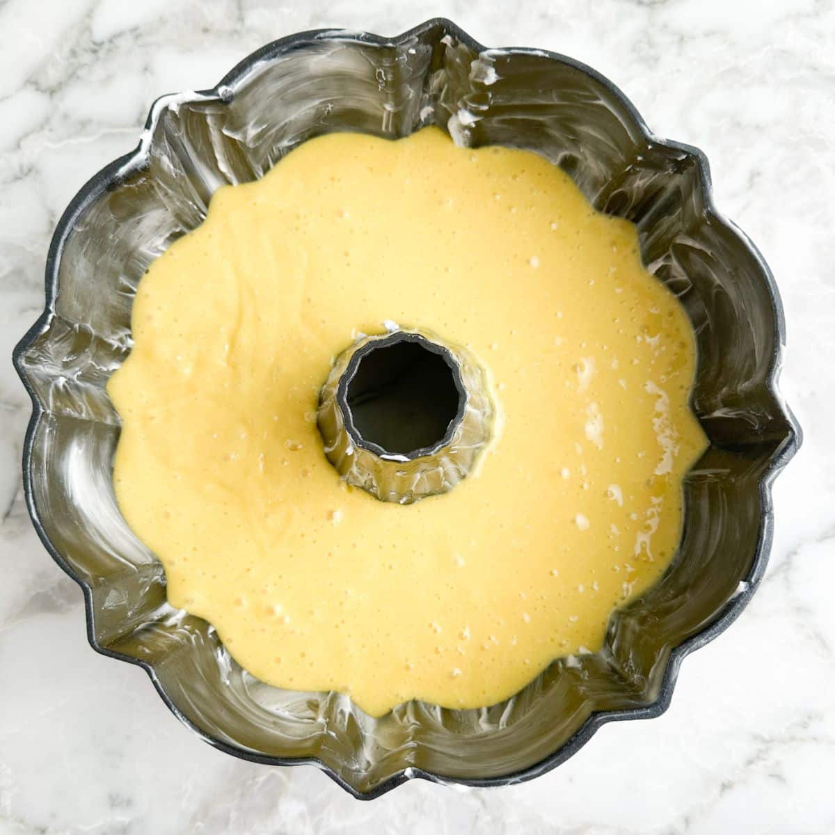 Bundt pan with cake batter.