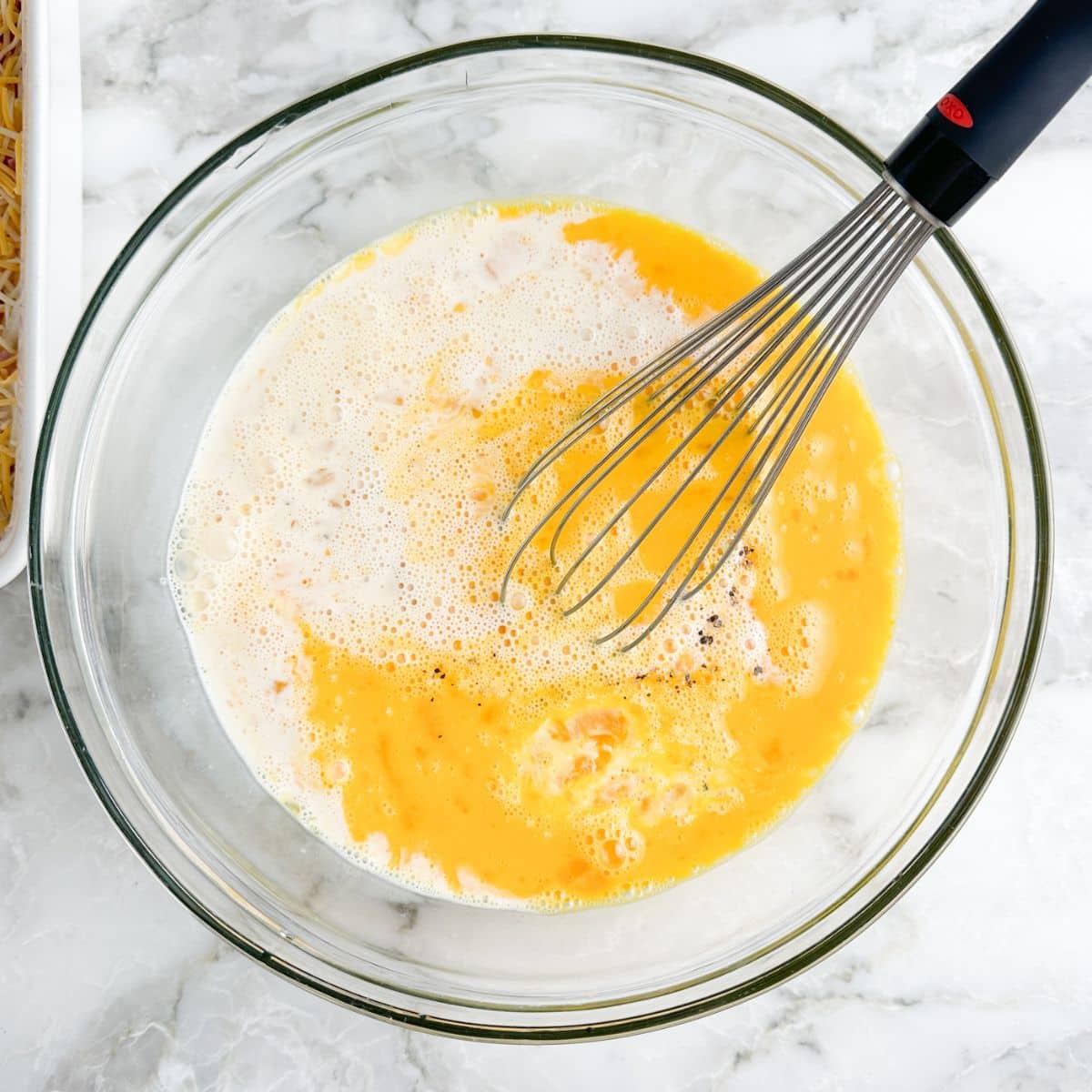 Bowl of eggs and evaporated milk.