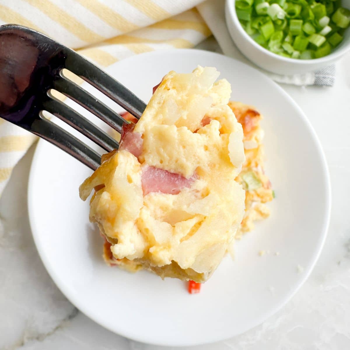 Fork with a piece of farmers casserole.
