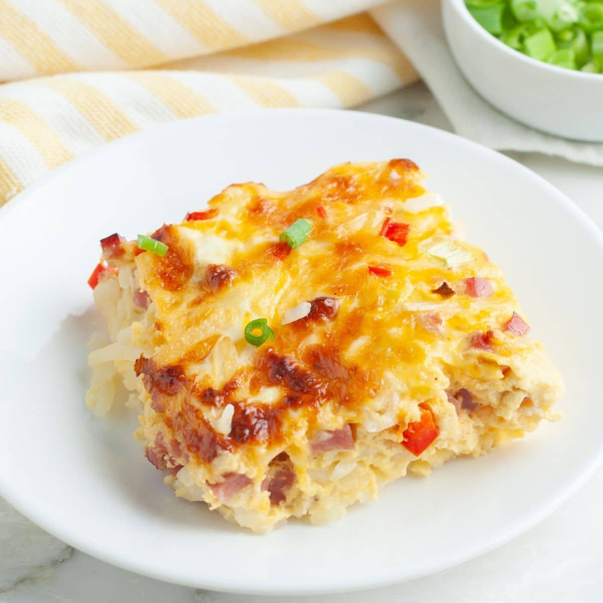Piece of farmers casserole on a plate.