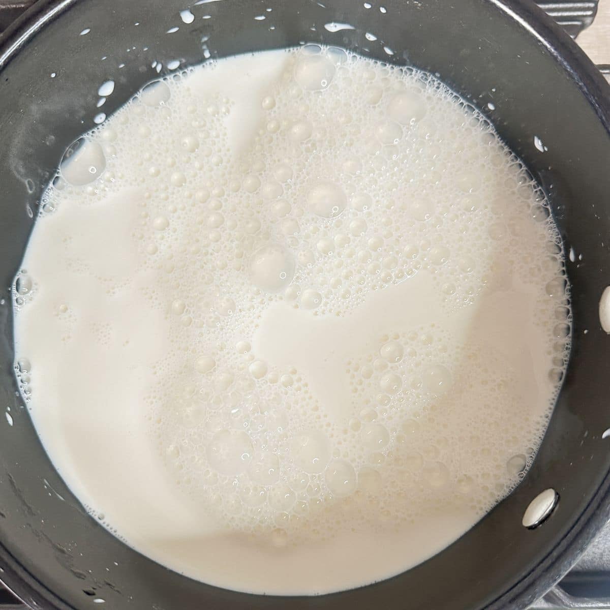 Saucepan with milk.